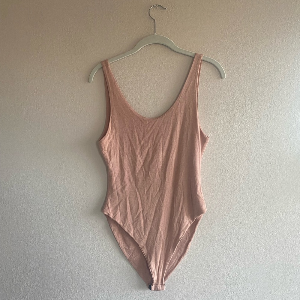 pale pink body suit